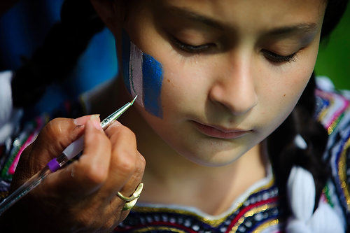 First Place, Student Photographer of the Year - Joel Hawksley / Ohio UniversitySindi Rodas, 11, has her face painted by Elida Williams during the annual St. Joseph Festival at Lamar Park in Wyoming on Sunday, August 8, 2010.