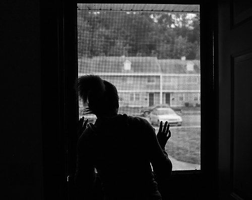 Second Place, Sports Picture Story - Carrie Cochran / Cincinnati EnquirerRaynesha looks out the window of their apartment, which is part of a government-subsidized housing project. According to 2008 Census data, 51.4% of households are single-mother families in Millvale, versus 14.1% overall in the city. As a single parent, her father says that he feels for the young girls raising children on their own. He doesn't want that to happen to Raynesha. 