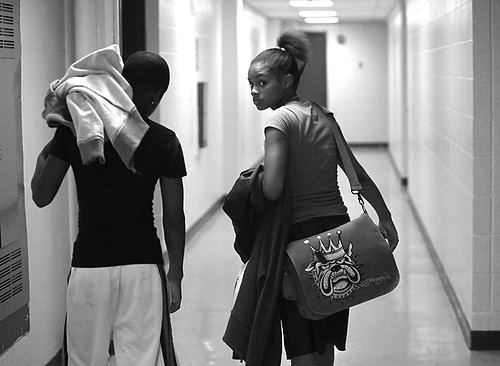 Second Place, Sports Picture Story -  / With her father still in the gym, Raynesha catches a brief moment out of his sight as she walks from the center to their car.