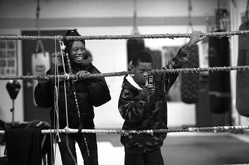 Second Place, Sports Picture Story -  / Spectators watch Raynesha and her brother, Ray Ray, spar in the ring.