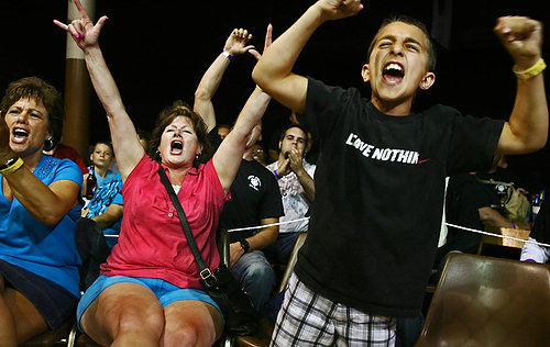 First Place, Sports Picture Story - Ed  Suba Jr / Akron Beacon JournalJanie Smoley, Donna Hettick and Matthew Smoley react as a member of the Goliath Fight Team wins his bout during Caged Madness, an amateur mixed martial arts event.