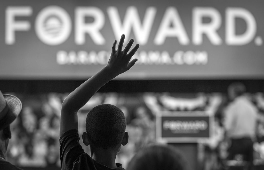 Award of Excellence, Campaign 2012 - MIchael E. Keating / FreelanceA young boy raises his hand while hoping the President will call on him during a question and answer session during a campaign visit to Cincinnati.  This original was show in black and white mode....
