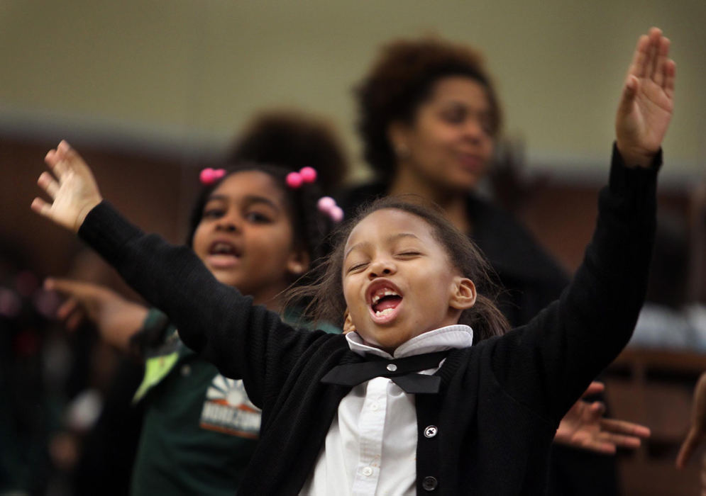 Second place, Feature Picture Story - Gus Chan / The Plain DealerEl Sistema is the celebrated music-education program started in Venezuela that takes youths off the streets and teaches them to play in symphony orchestras.  El Sistema @ Rainey is Cleveland's version of the program, started by Cleveland Orchestra violinist Isabel Trautwein.  Destiny Star White sings the "Rainey" song during El Sistema September 29, 2012.  The song describes the Rainey Institute and it's artistic mission.