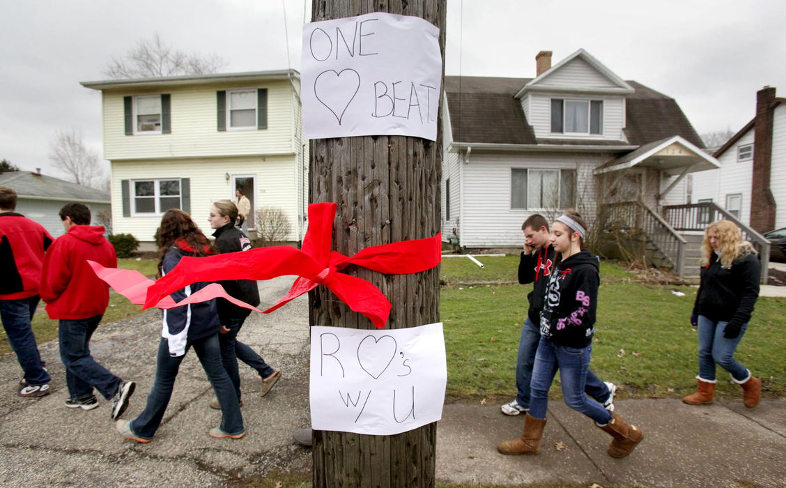 Second place, News Picture Story - Marvin Fong / The Plain DealerChardon High School students joined by parents and supporters, march from the town square to the school.   Students re-entered the school for the first time since the shootings that killed three students and injured three others.
