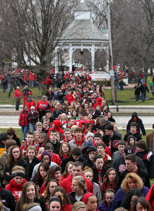Second place, News Picture Story - Marvin Fong / The Plain DealerChardon High School students joined by parents and supporters, march from the town square to the school, proclaiming unity and to take back the town.    Students re-entered the school for the first time since the shootings  that killed three students and injured three others. 