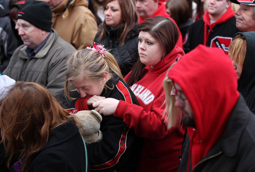 Second place, News Picture Story - Marvin Fong / The Plain DealerChardon High School students, joined by parents and supporters, pause to remember the  three students killed at their school.   