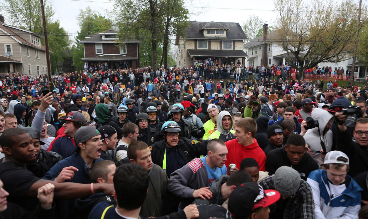 Third place, News Picture Story - Coty Giannelli / Kent State UniversityPolice officers return to College Avenue to restore order and allow medical vehicles access to the street.