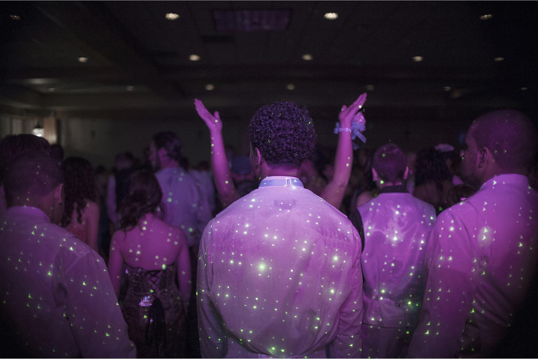 First place, James R. Gordon Ohio Understanding Award - David Foster / Kent State UniversityFriends greet members of the Massillon Tiger football team as they enter the dance floor during the prom at the Knight of Columbus hall in Massillon