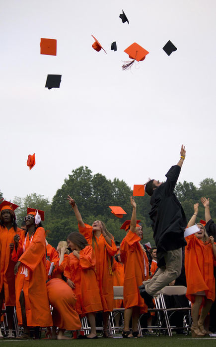 First place, James R. Gordon Ohio Understanding Award - Caitlin Bourque / Kent State UniversityGarrett Keiger, a member of the 2011 Massillon football team, leaps into the air as he tosses his mortarboard with other graduates at the conclusion of the 2011 spring ceremony. A few months later, Principal Brad Warner and the faculty at Massillon Washington High School received a notice from the Ohio Department of Education that the school received an “Excellent” rating, awarded to schools that excel in a diverse and specific list of requirements.