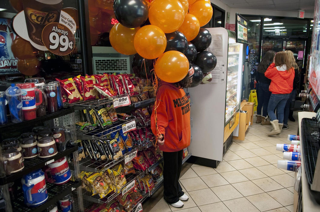 First place, James R. Gordon Ohio Understanding Award - David Foster / Kent State UniversityMassillon resident with balloons during McKinley week