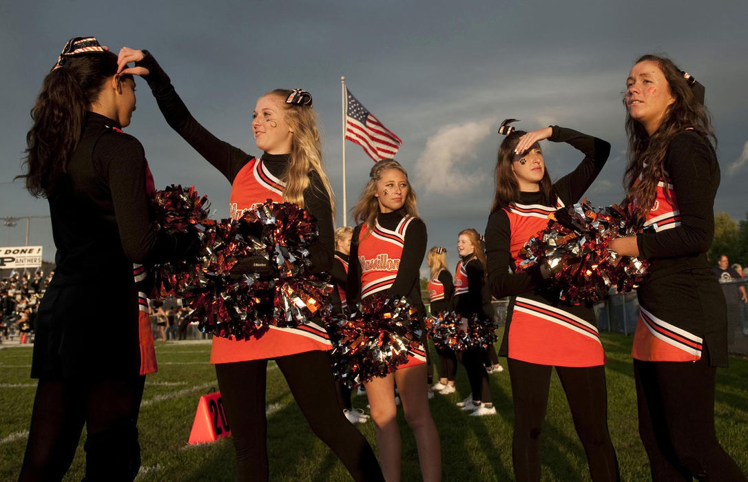 First place, James R. Gordon Ohio Understanding Award - Gary Harwood / Kent State UniversityCheerleaders are captured in the setting sun prior to the start of the 2012 game at Perry