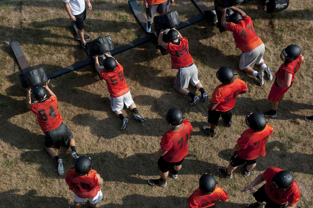 First place, James R. Gordon Ohio Understanding Award - Gary Harwood / Kent State UniversityLinemen work on blocking drills outside the Paul Brown Stadium field during a morning practice. The heat and the intensity of the mid-summer practices can be very difficult but this summer was even more challenging because of a lengthy drought.