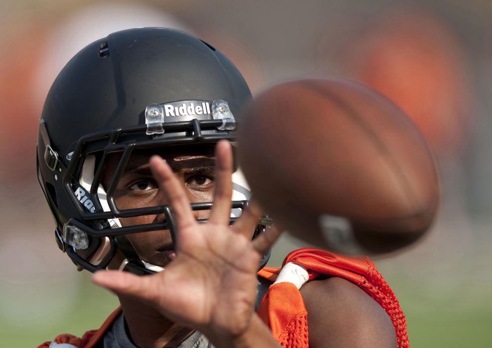 First place, James R. Gordon Ohio Understanding Award - Gary Harwood / Kent State UniversityLyron Wilson works on his pass catching skills during a morning drill at Paul Brown Stadium. The rhythm and routine of the drills and the consistency of the daily practices improve the fundamentals that are critical to the performace of the players during the season.