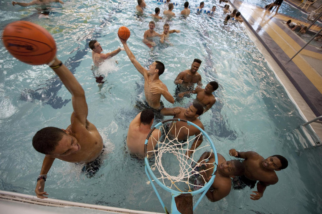 First place, James R. Gordon Ohio Understanding Award - David Foster / Kent State UniversityMembers of the Tigers football team play pool basketball during a break from training camp practice at Ashland University. Coach Jason Hall believes the more connected the players are to each other, the more cohesive the team performance will be during the season.