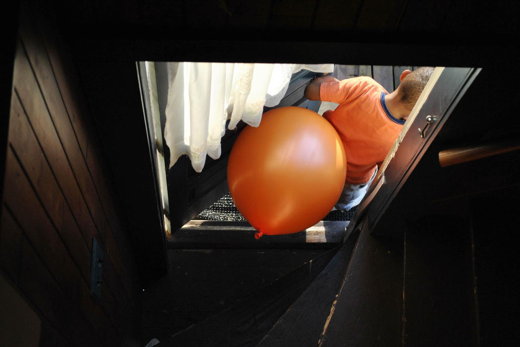 First place, Pictorial - Alexis Pfeifer / Kent State UniversitySix-year-old Joshua Pennington flees his house with his new toy, a punching balloon. Joshua was eager to run outside with his new balloon but popped it minutes later. At three years old, his mother picked up on his signs of autism. He was diagnosed last year on the Autism Spectrum.