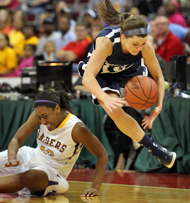 First place, Photographer of the Year - Large Market - Gus Chan / The Plain DealerTwinsburg's Nichole Mabry goes airborne past Reynoldsburg's Destini Cooper as the two battle for a loose ball during the Division I state basketball semifinal game.