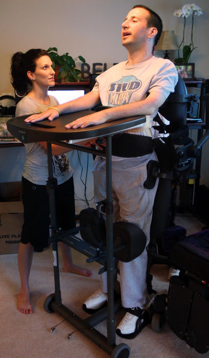 Award of Excellence, Photographer of the Year - Large Market - John Kuntz / The Plain DealerScott with the aid of occupational therapist Holly Widder stands in a device used to get patients with leg disabilities up in the body's natural position. Standing, even with the help of a machine, builds muscle strength, improves bone density and prepares people with spinal cord injuries for the day they hope they will walk again.