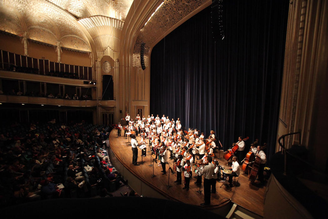 First place, Photographer of the Year - Large Market - Gus Chan / The Plain DealerA mix of El Sistema kids, Cleveland Orchestra members and orchestra children perform together on stage at Severance Hall as part of the Martin Luther King Day festivities.  Artistic Director Isabel Trautwein's connection to the Cleveland Orchestra has give musicians from El Sistema @ Rainey opportunities unavailable otherwise.