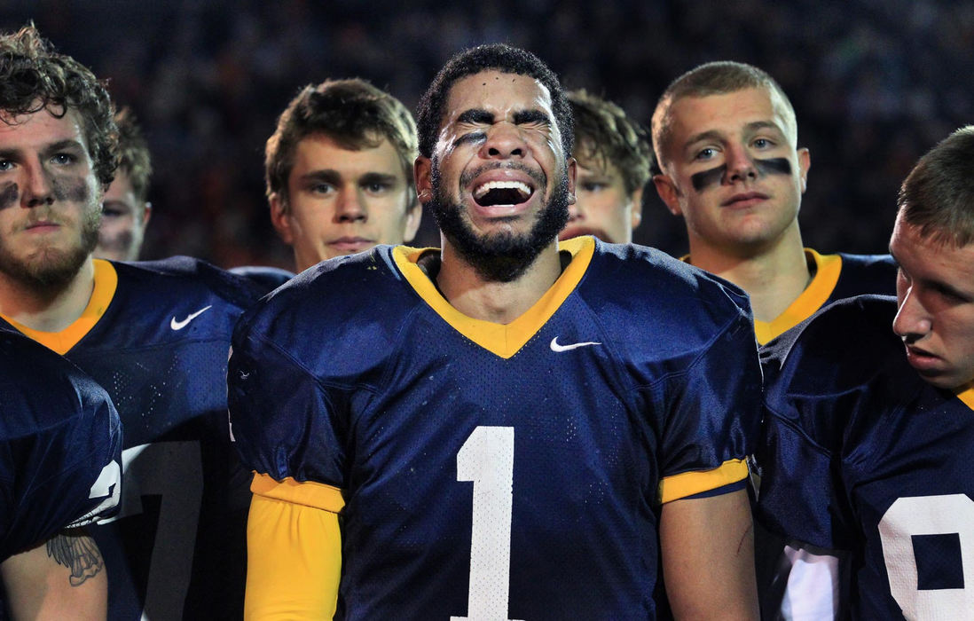 First place, Photographer of the Year - Large Market - Gus Chan / The Plain DealerKirtland's Damon Washington unabashedly cries as his  team is brought to the awards stand to receive their state runner up trophy in Division VI football.  Kirtland, the state champion in 2011, was defeated this year by the same team they defeated the previous year, Coldwater.