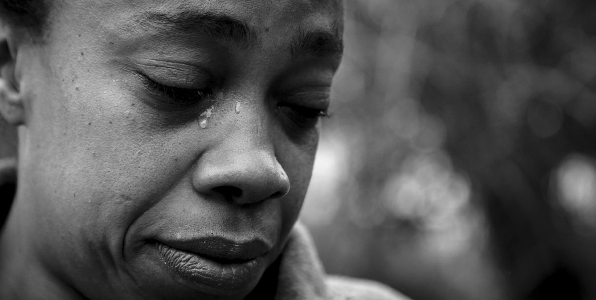 Second place, Photographer of the Year - Large Market - Michael E. Keating / FreelanceYevette Hooten, mother of Mark Hooten who was gunned down in a South Cumminsville Street in 2009, visits the shooting scene.  A suspect in her son's murder was indicted yesterday.  