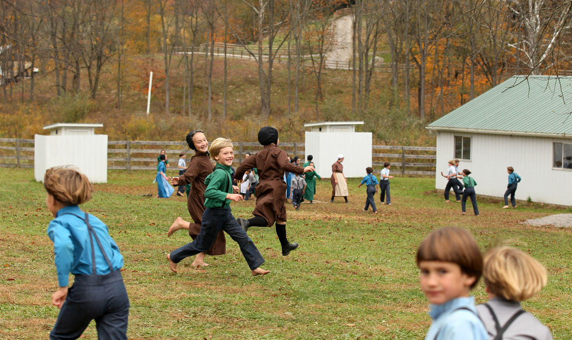 Third place, Photographer of the Year - Large Market - Marvin Fong / The Plain DealerAmish children play outside their school house  in Bergholz, OH.  Several of the children have parents who will be serving prison time for their convictions in beard and hair cutting attacks.   The community  ponders a future without them to help raise the children and handle farm duties.   