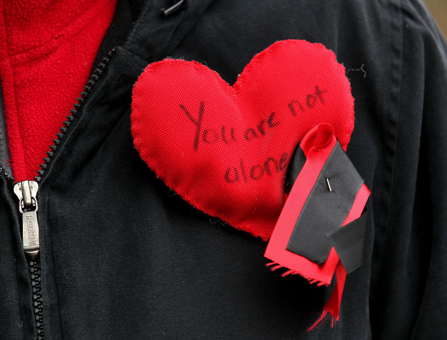 Third place, Photographer of the Year - Large Market - Marvin Fong / The Plain Dealer Chardon High School students and parents wearing support  pins, walked to their school and re-entered the building for the first time since the shootings that killed three students and injured three others.  