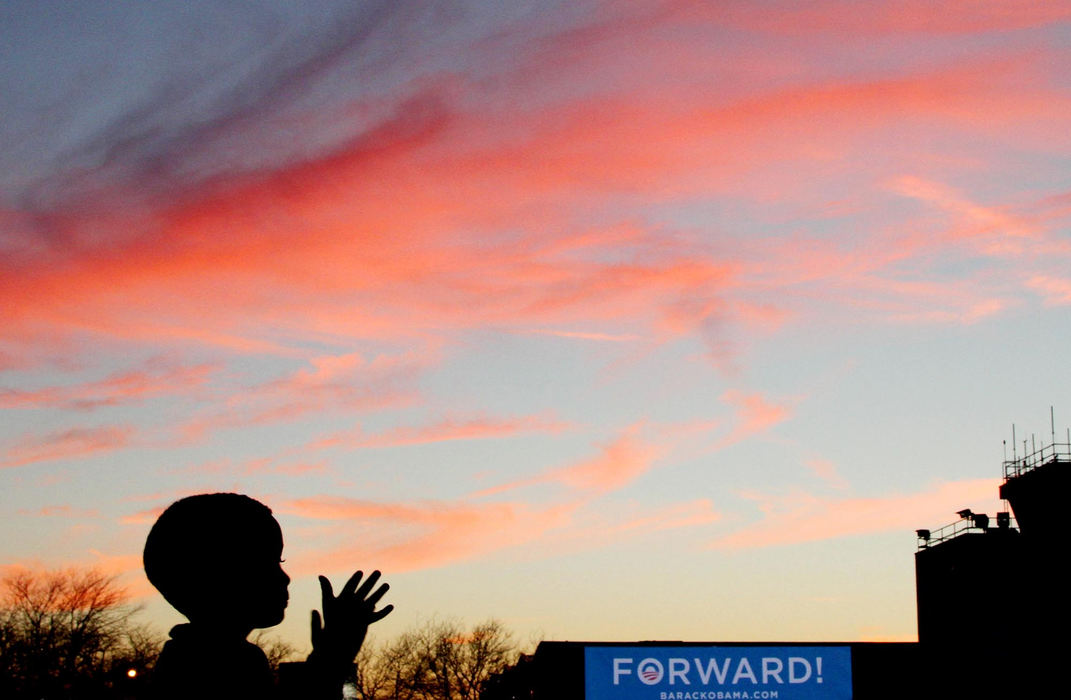 Award of Excellence, Photographer of the Year - Large Market - John Kuntz / The Plain DealerA young supporter for President Barack Obama is silhouetted with the Obama Forward sign in the crowd during a campaign stop October 25, 2012 on the tarmac at Burke Lakefront Airport in Cleveland.  