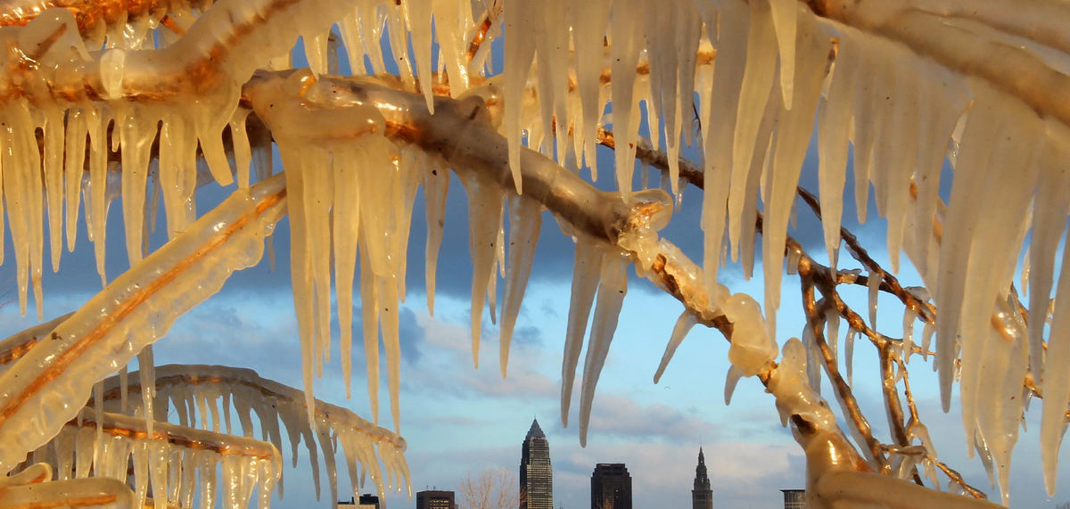 Award of Excellence, Photographer of the Year - Large Market - John Kuntz / The Plain DealerThe late afternoon sun peaks out of the mostly cloudy sky and to briefly lightl the ice that formed on the trees along the breakwall near Edgewater Park January 18, 2012 in Cleveland.  