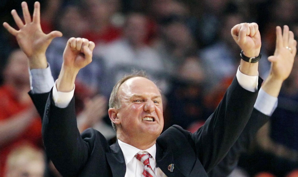 Award of Excellence, Photographer of the Year - Large Market - John Kuntz / The Plain DealerOhio State head coach Thad Matta celebrates a three-point score late in the second half against Syracuse with the arms of an assistant coach behind Matta during the 2012 NCAA men's basketball East Regional final at the TD Garden in Boston. 