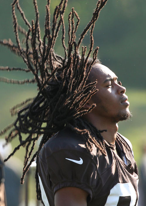 Award of Excellence, Photographer of the Year - Large Market - John Kuntz / The Plain DealerCleveland Browns receiver Travis Benjamin flips his hair back as he waits his turn to get back into offensive drills August 22, 2012 during training camp at the Browns' headquarters in Berea.    