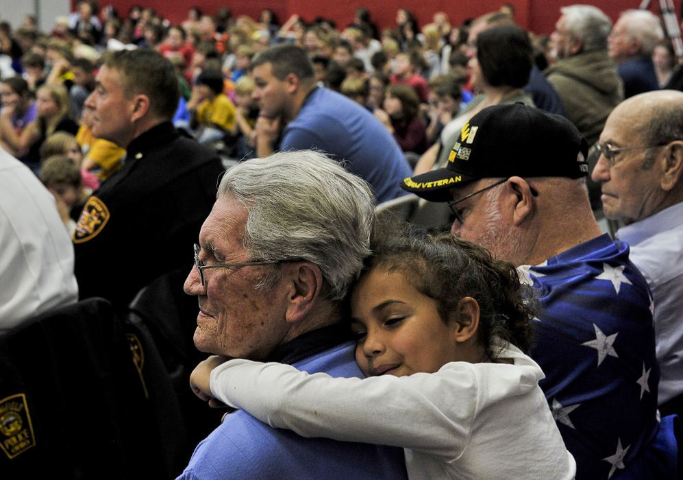 First place, Photographer of the Year - Small Market - Bill Lackey / Springfield News-SunSnowhill Elementary School honored America's veterans Monday, Nov. 12 with a special Veteran's Day Program in the school's gymnasium. The program included a speech from Ronald Rosser, who won the Medal of Honor during the Korean War.