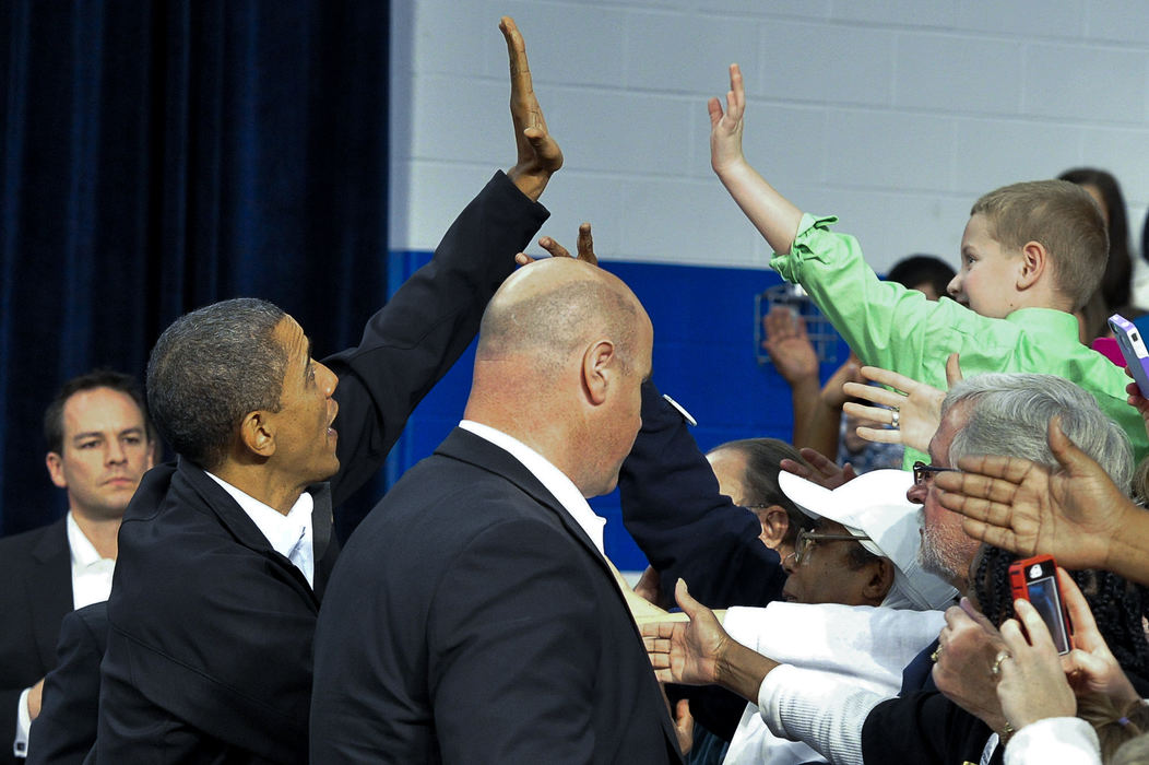 First place, Photographer of the Year - Small Market - Bill Lackey / Springfield News-SunPresident Barack Obama gives a young supporter a high five as he enters the gymnasium at Springfield High School for a campaign rally in Springfield, Ohio. 