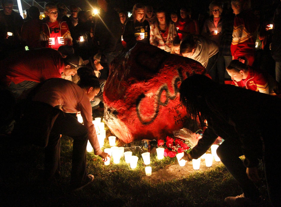 Second place, Photographer of the Year - Small Market - Barbara J. Perenic / Springfield News-SunA candlelight vigil was held at Northeastern High School after Tuesday's basketball game to honor18-year-old Cady Reed, a 2012 graduate of Northeastern who died in a car accident early Sunday morning. A spirit rock which was a recent addition at the front of the campus was painted pink in Reed's honor and adorned with candles and roses.
