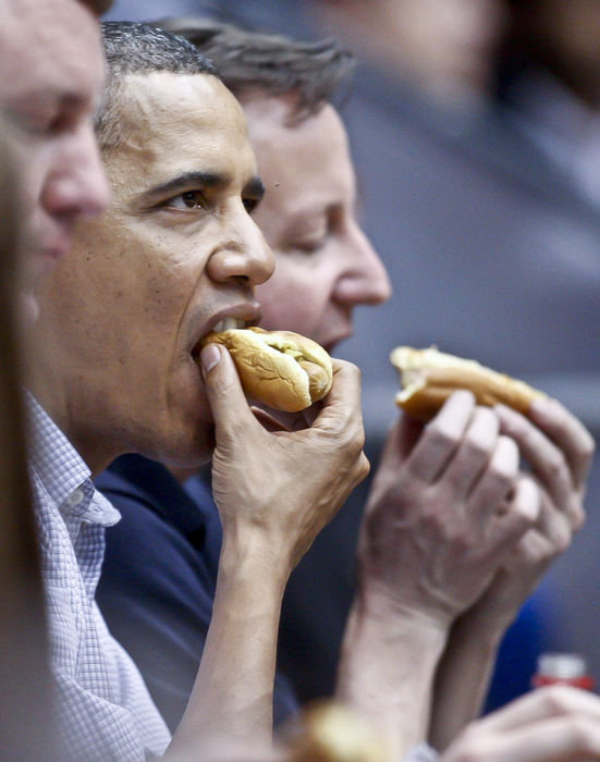 Second place, Photographer of the Year - Small Market - Barbara J. Perenic / Springfield News-SunPresident Barack Obama enjoys a hot dog with mustard while attending the NCAA First Four basketball game between Mississippi Valley State and Western Kentucky with British Prime Minister David Cameron and Ohio Governor John Kasich at University of Dayton Arena.