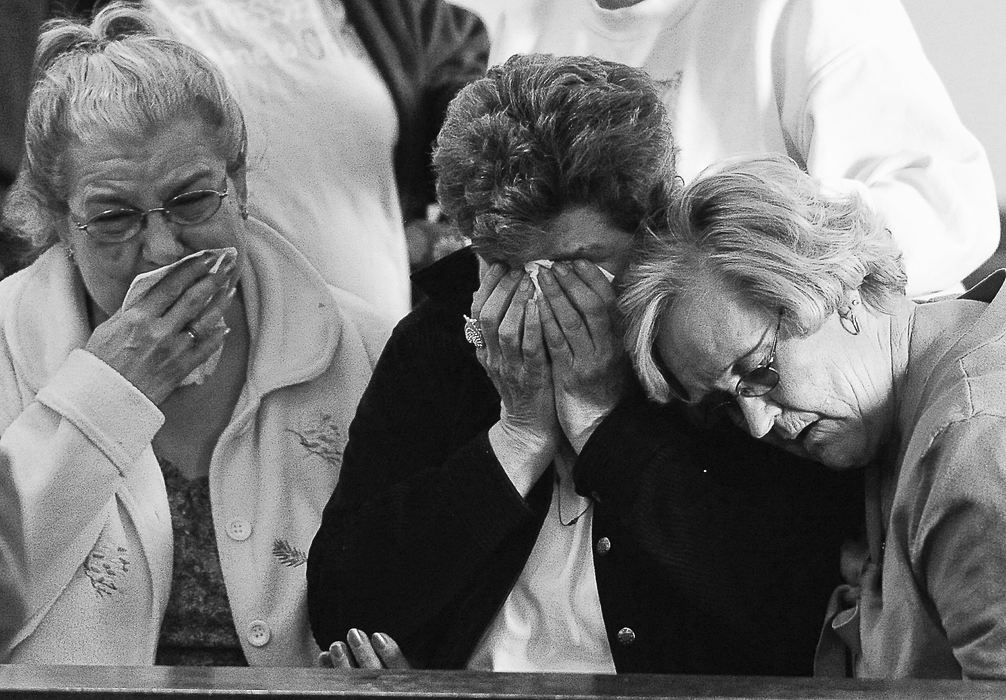 First place, Photographer of the Year - Small Market - Bill Lackey / Springfield News-SunJanet Finfrock, center, the mother of James Pierce, is consoled by friends and family Thursday, Feb. 2  as she reacts in court after former prosecutor James Berry was found not guilty of leaving the scene of a crash that killed her son.