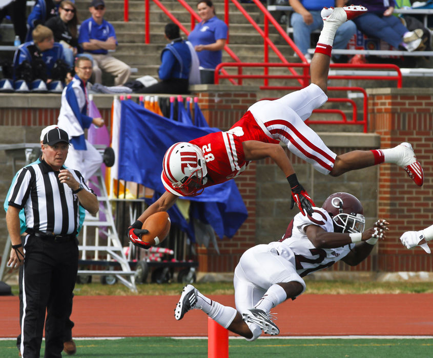 Second place, Photographer of the Year - Small Market - Barbara J. Perenic / Springfield News-SunDesi Kirkman (82) of Wittenberg somersaults over Mychael Gilliam (20) of Chicago.