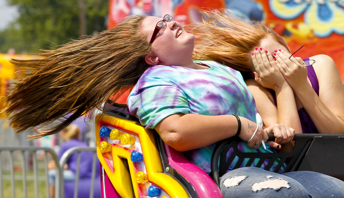 Second place, Photographer of the Year - Small Market - Barbara J. Perenic / Springfield News-SunTabitha George, 15, and Mikayla Goings, 16, let their hair fly as they ride the Scrambler.