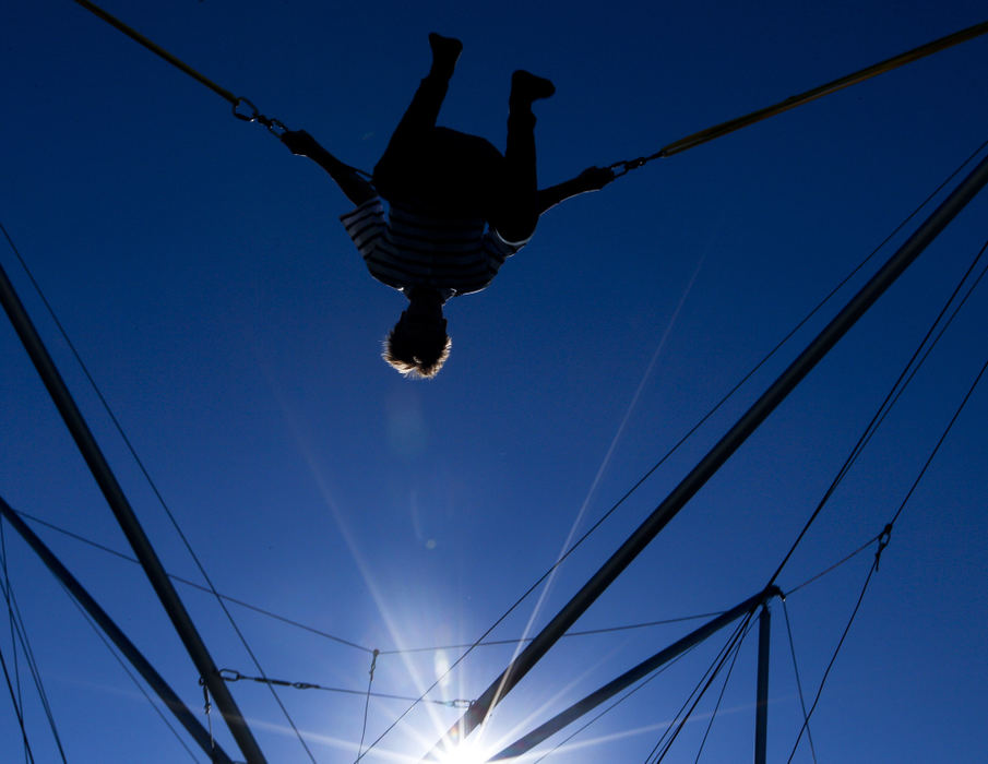 Second place, Photographer of the Year - Small Market - Barbara J. Perenic / Springfield News-SunReese Shafter, 14, does a flip on the Euro Bungy as the sun set on the county fair