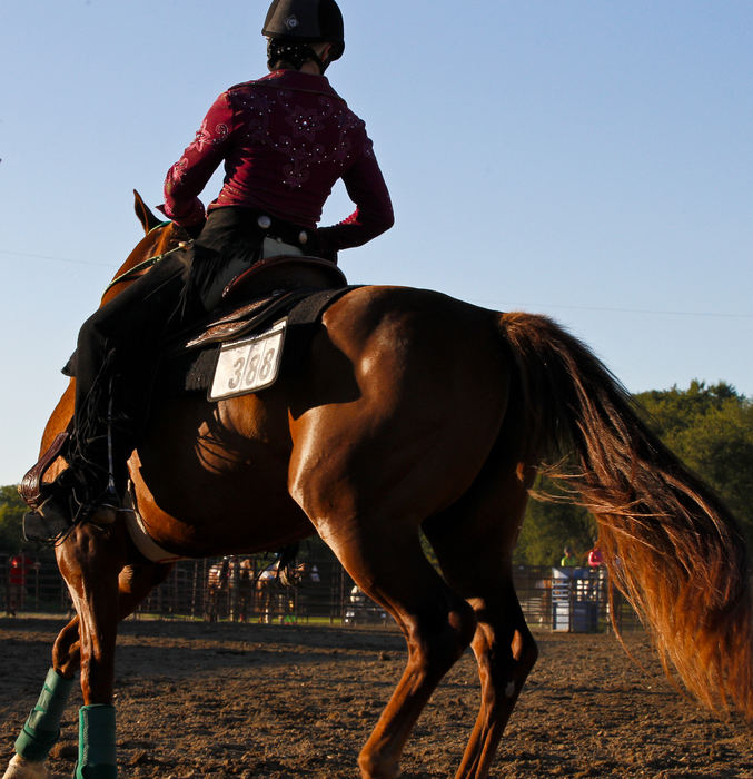 Second place, Photographer of the Year - Small Market - Barbara J. Perenic / Springfield News-SunLeah Bender competes in versatility riding as the sun sets.