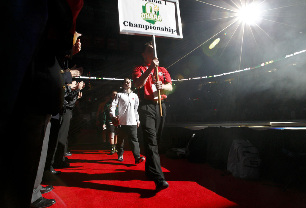 Second place, Photographer of the Year - Small Market - Barbara J. Perenic / Springfield News-SunWrestlers enter the arena during the Parade of Champions before the finals of the OSHAA State Wrestling Tournament.