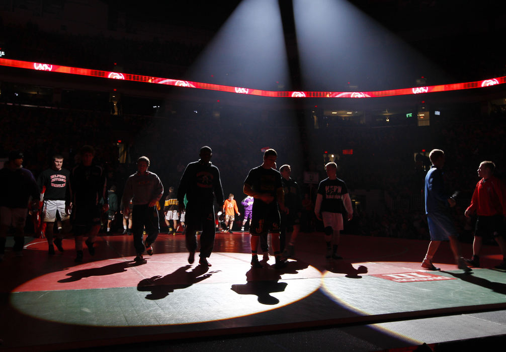 Second place, Photographer of the Year - Small Market - Barbara J. Perenic / Springfield News-SunWrestlers shake hands with their opponents during the Parade of Champions before the finals of the OSHAA State Wrestling Tournament.