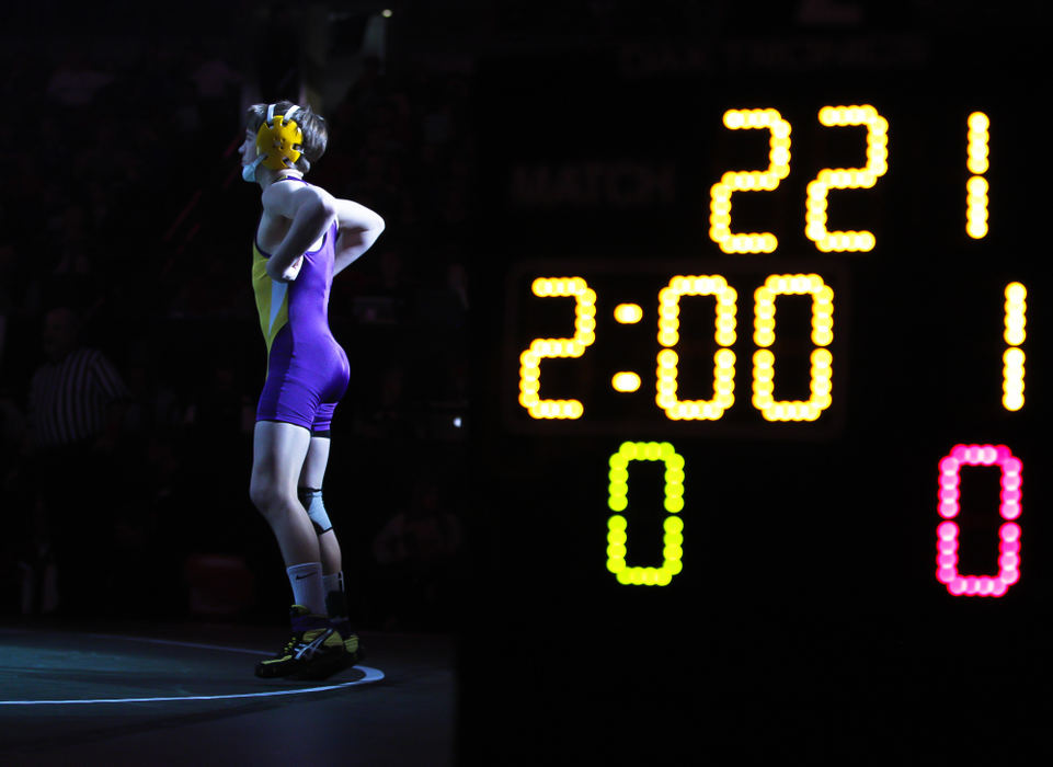 Second place, Photographer of the Year - Small Market - Barbara J. Perenic / Springfield News-SunCameron Kelly of Bellbrook prepares for his match against Cody Butcher of Uhrichsville Claymont at 106 lbs. in Division II during the finals of the OSHAA State Wrestling Tournament.