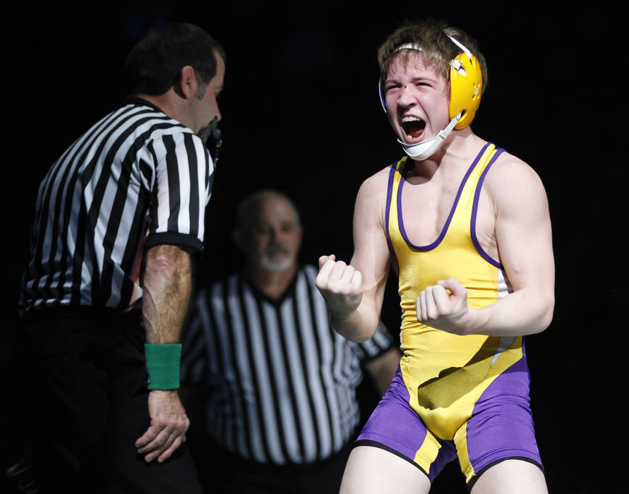 Second place, Photographer of the Year - Small Market - Barbara J. Perenic / Springfield News-SunCameron Kelly of Bellbrook celebrates a win over Cody Burcher of Uhrichville Claymont at 106 lbs. in Division II during the finals of the OSHAA State Wrestling Tournament.