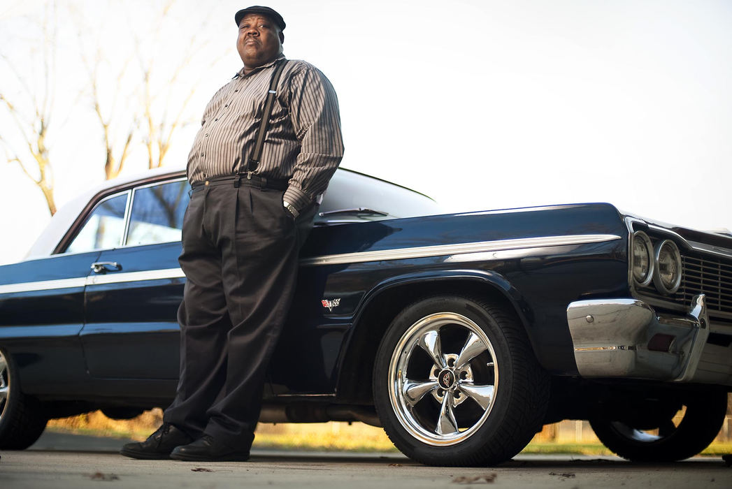 Third place, Portrait Personality  - Eamon Queeney / The Columbus DispatchLuther Henson leans on his 1964 Chevy Impala Super Sport as he poses for a photograph in the driveway of his North Side Columbus home. This Impala and a 1969 Chevy Chevelle Super Sport were stolen from his garage as well as other items that counted together were worth hundreds of thousands. 