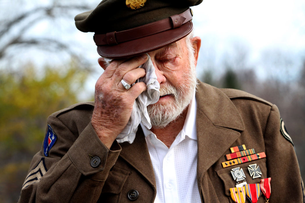 Award of Excellence, Portrait Personality - Lynn Ischay / The Plain DealerMorris Finney Jr. wipes away tears as he listens to "God Bless America" at Beachwood Cemetery at 11am, November 11th, 2012. Finney, 89, served in the Army and fought in New Guinea, the Phiippines and Japan during WWII. He has been a resident of Beachwood for 56 years, and this year the city held its very first Veterans Day ceremony at the cemetery.