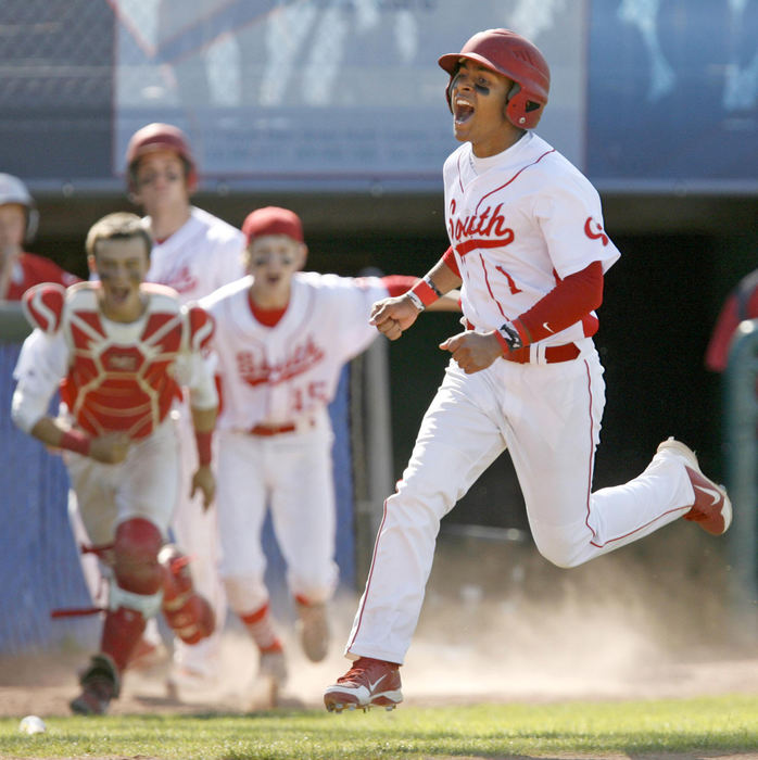 Award of Excellence, Sports Action - Scott Heckel / The RepositoryCanton South's Deonte Settles races home to score the winning run in the bottom of the 12th inning to give the Wildcats a 1-0 victory over Triway in the D2 district semi final baseball game at Thurman Munson Stadium in Canton.