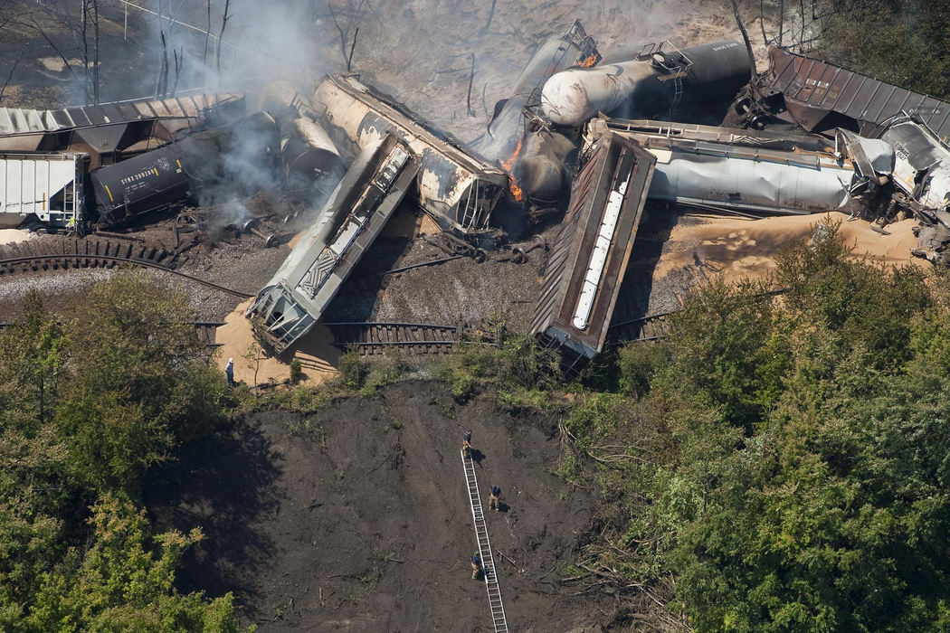 Second place, Spot News (Over 80,000) - Eamon Queeney / The Columbus DispatchSmoke rises as fire still burns in the debris of a derailed 98 car train just south of the Ohio State Exposition Center as fire crews begin to extinguish the fire, Wednesday afternoon, July 11, 2012. Eleven to 13 cars, many of which were tankers carrying 3,000 gallons of ethanol each, train derailed around 2 am, caught fire and exploded. Officials are still unsure as to the cause of the crash and have evacuated about 100 residents within a 1-mile radius. Two onlookers were injured as they came to inspect the scene. 