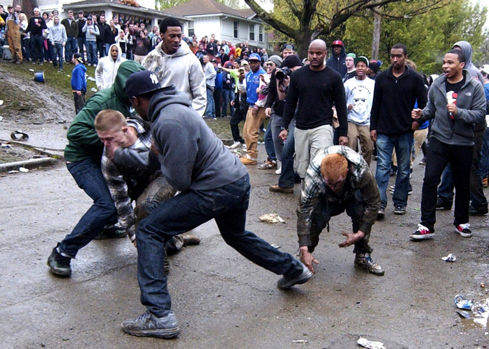 Second place, Spot News (Under 80,000) - Matt Hafley / Kent State UniversityMultiple fights broke out during the annual drinking festival in Kent on College Ave on April 21. 2012.  Police were forced to intervene when the fights got out of hand using less-than-lethal methods to disperse the party-goers.
