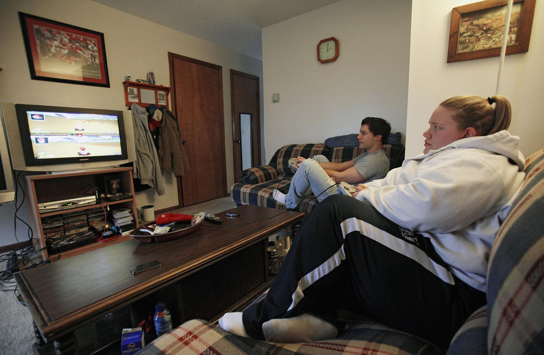 Award of Excellence, Sports Portfolio - Kyle Robertson / The Columbus DispatchHolley Mangold and one of her roommates Brett Hastings play Mario Cart video games before training in her apartment in Columbus, February 21, 2012.