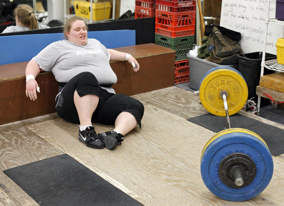 Award of Excellence, Sports Portfolio - Kyle Robertson / The Columbus DispatchHolley Mangold takes a second to gather herself after falling during a snatch lift during a training session at the YMCA North in Columbus, February 20, 2012. 